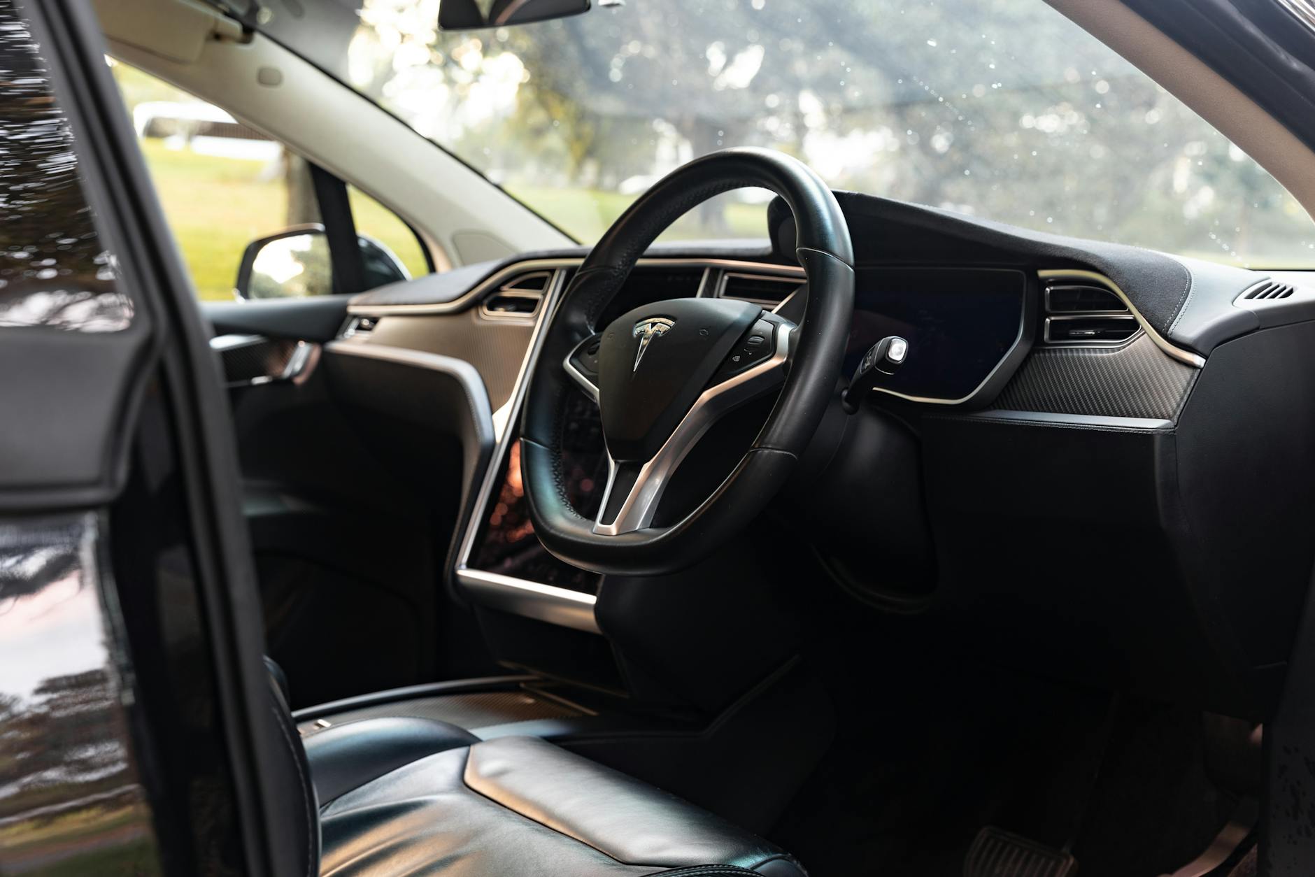 HOW TESLA INFLATED RANGE ESTIMATES IN VEHICLES AND MARKETING
