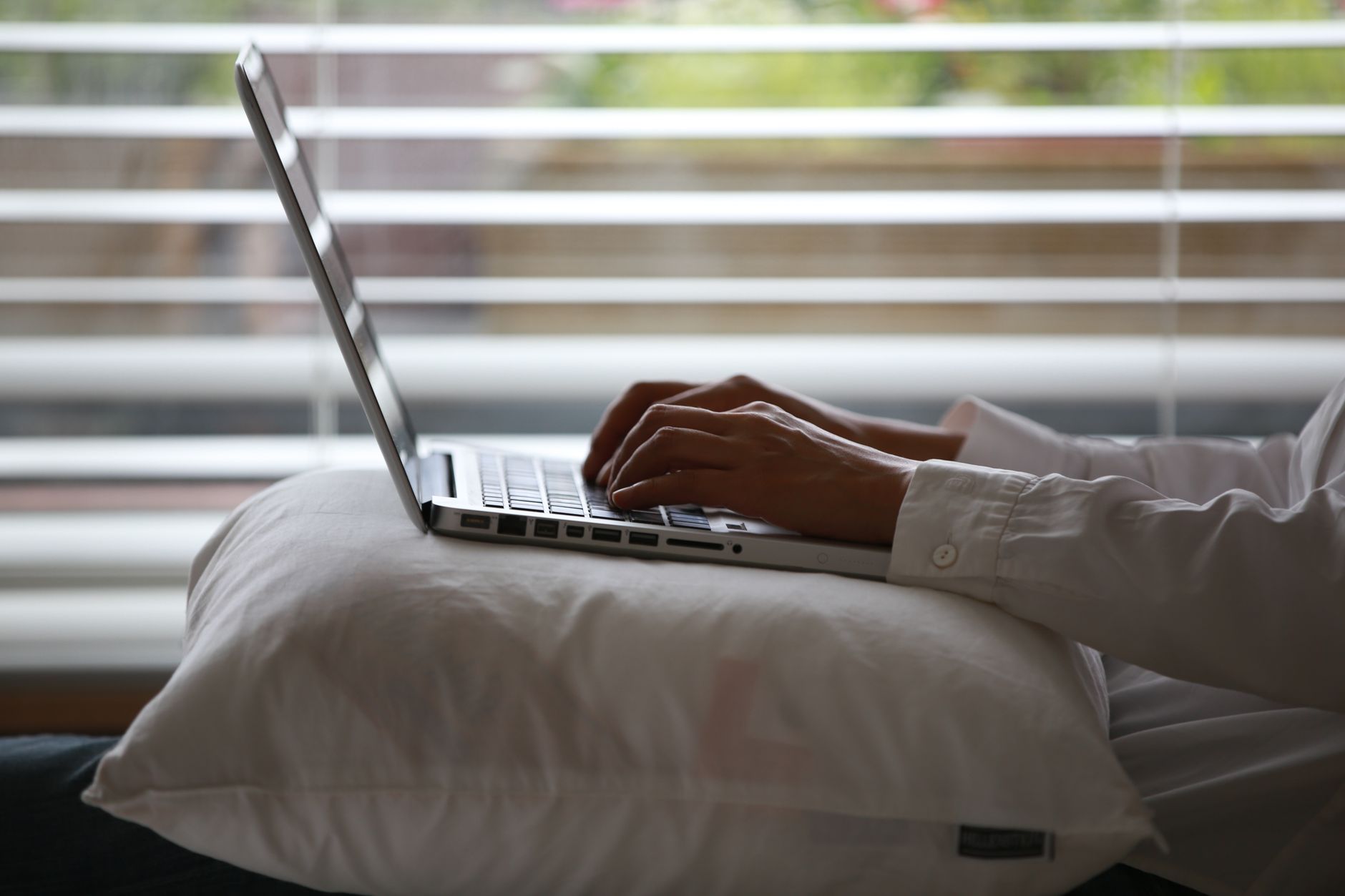 Hands typing on a laptop keyboard, illustrating the Alastin website accessibility class action