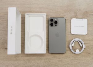 Unboxed iPhone Pro, one of the models covered by the Apple Intelligence Siri settlement