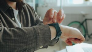 A smartwatch on a wrist, illustrating the Apple Watch software support class action
