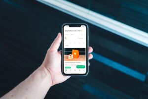 Phone with a restaurant loyalty app, illustrating the dismissed Chick-fil-A data breach lawsuit