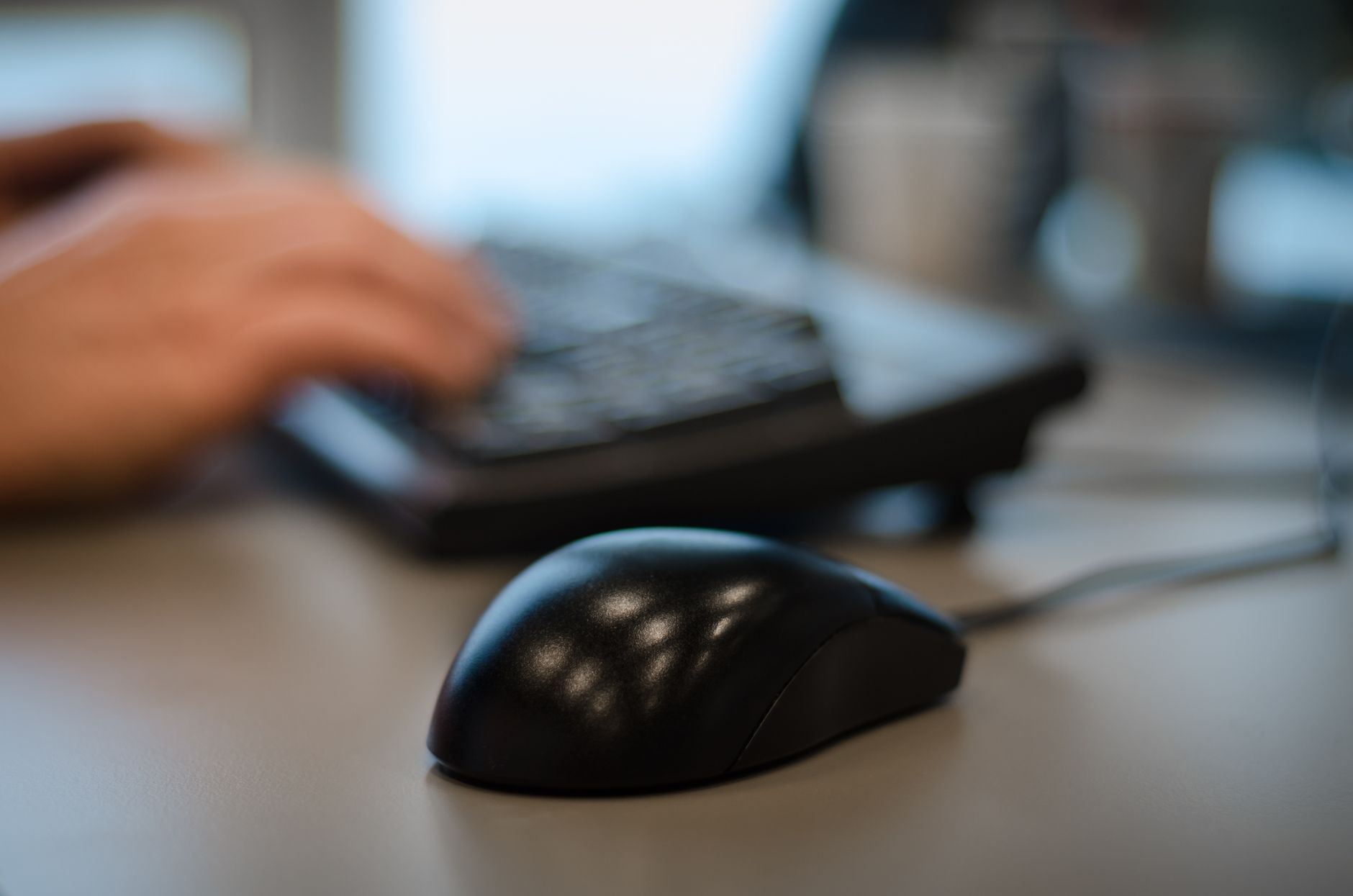 Computer mouse and keyboard on a desk, illustrating the Logitech tariff refund class action