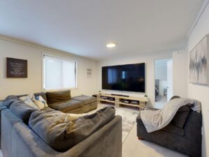 Flat-screen television in a living room, illustrating the Samsung Mini LED TV class action