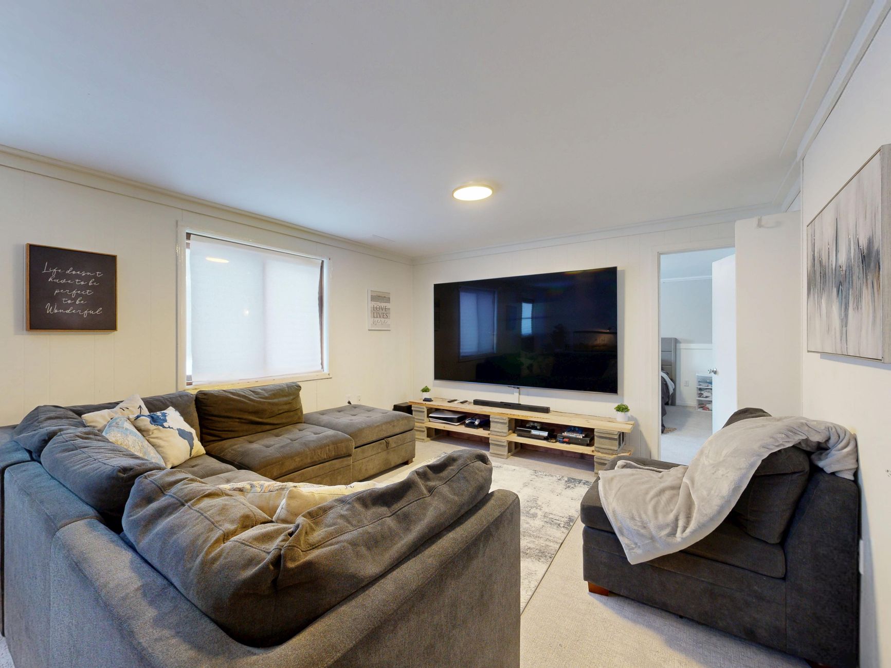 Flat-screen television in a living room, illustrating the Samsung Mini LED TV class action